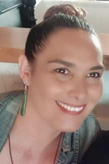 Head and shoulders photo of Kirimoana Pook smiling